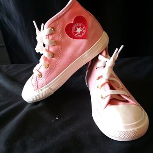 Girls pink Converse with red heart Converse emblem